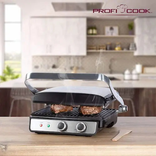 Grill with steaming food on a kitchen counter, branded 'Profi Cook'.