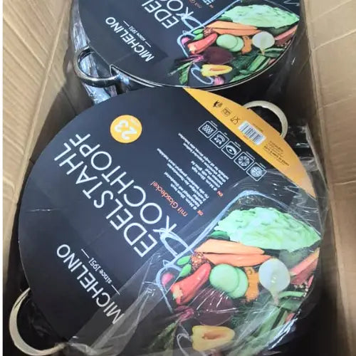 cooking pot with vegetable illustrations on a cardboard surface