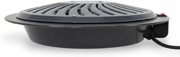 Black electric grill with a power cord on a white background