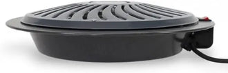 Black electric grill with a power cord on a white background
