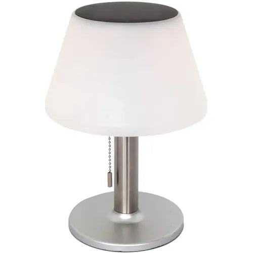 Table lamp with white shade, black top, and silver base on a white background