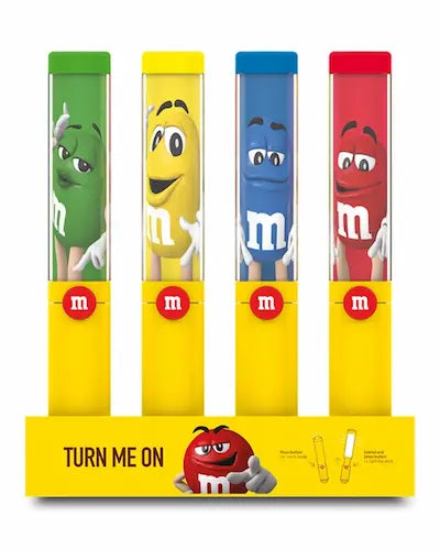 Four M&M character figurines in colorful tubes with a yellow base.