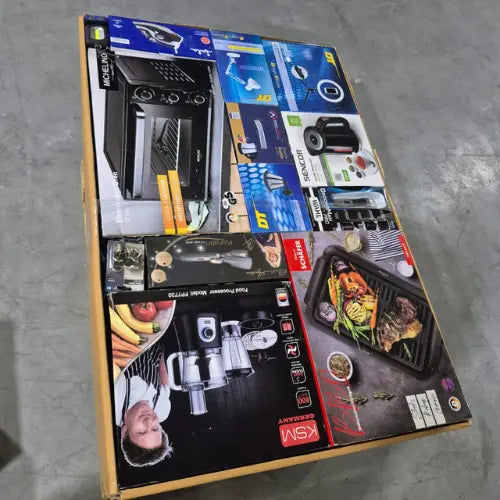 Collection of wholesale  kitchen appliance boxes on a concrete floor