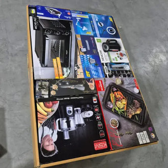 Collection of wholesale  kitchen appliance boxes on a concrete floor